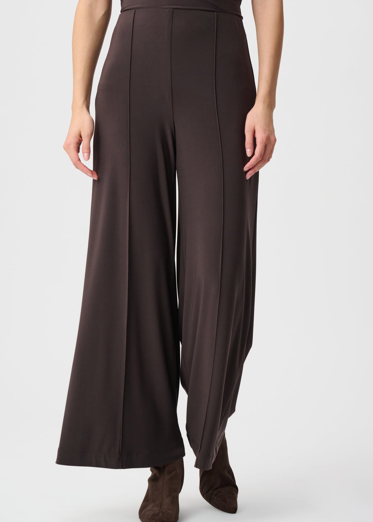 Brown wide-leg pants worn by a person on a white background