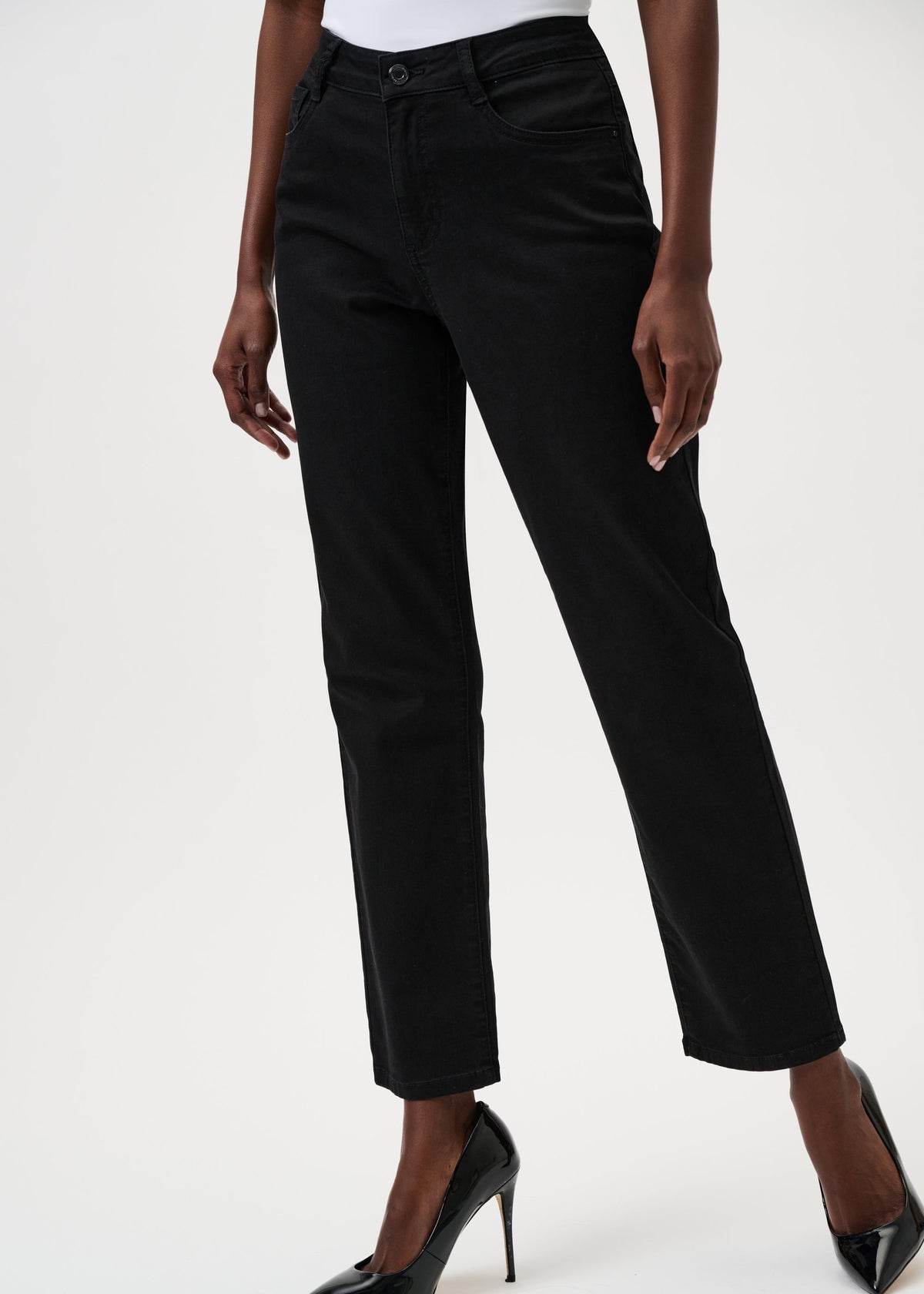 Person wearing black pants on a white background