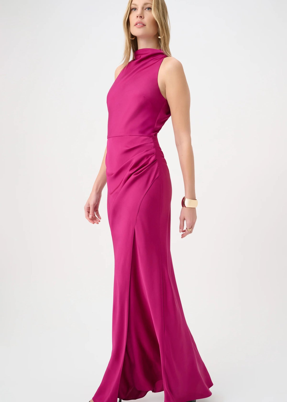 Woman wearing a pink evening gown on a white background