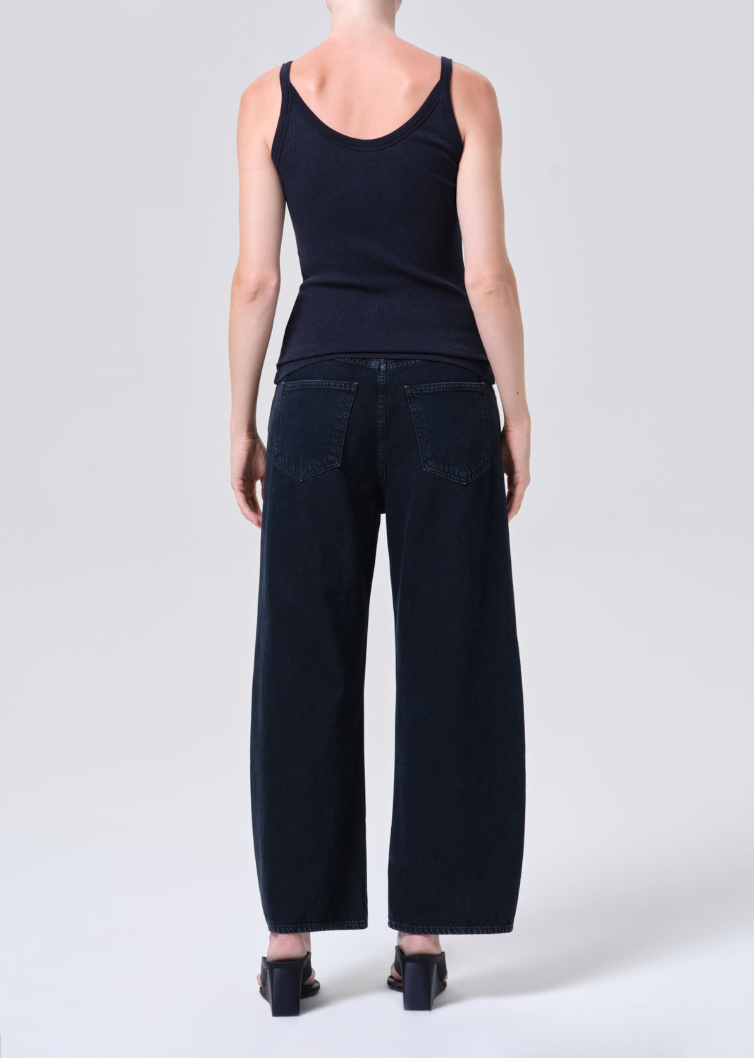 Woman in dark jeans