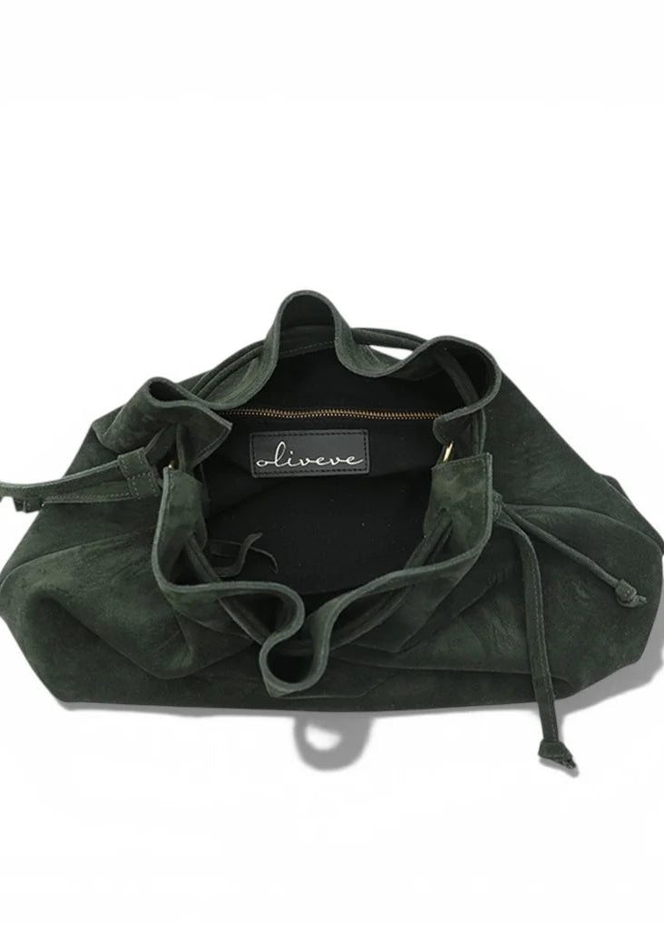 An olive green suede drawstring bag with a black interior lining and a visible 'oliveve' brand label, photographed on a clean white background.