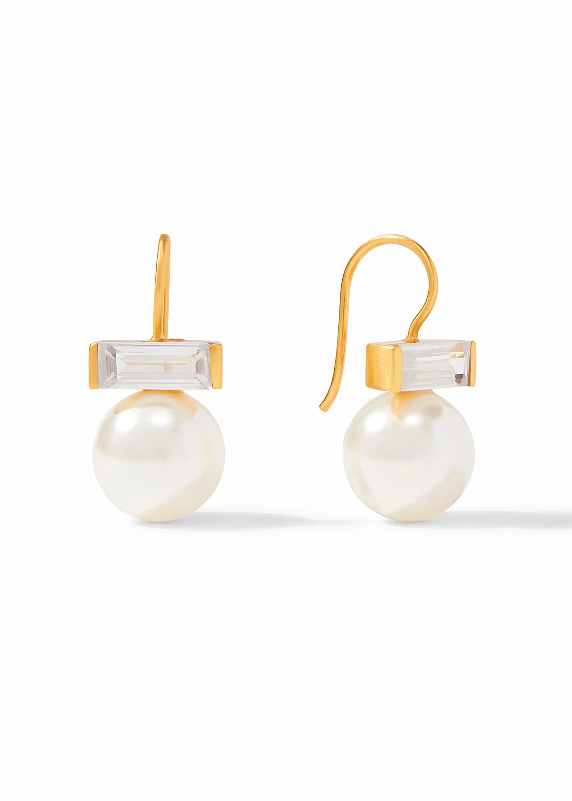 Pair of pearl earrings with gold hooks on a white background