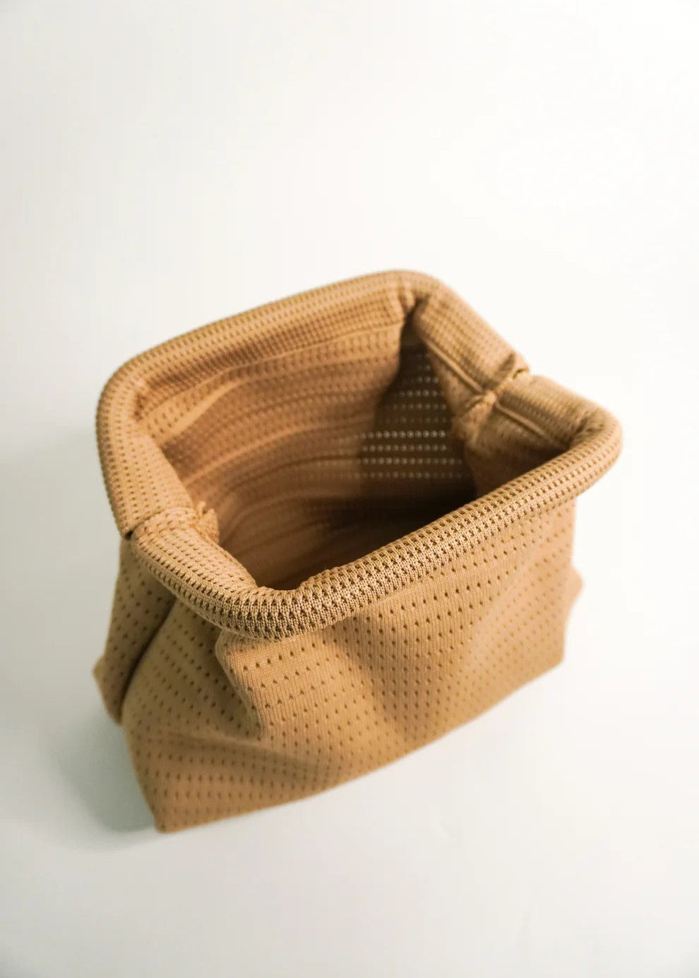 Brown woven basket on a white background