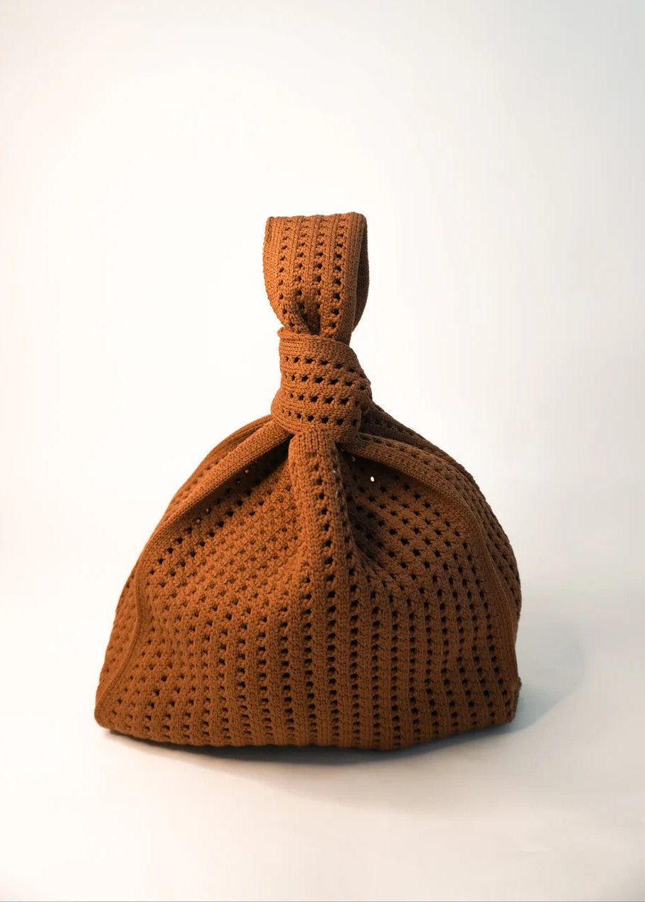 Brown knitted bag on a white background