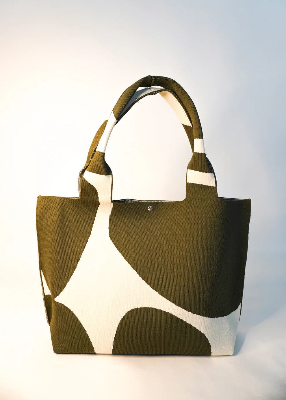 Brown and white patterned tote bag on a light gray background