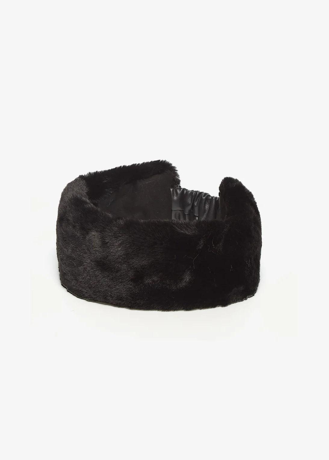 A wide black faux fur headband with a wide elastic band visible on the inside, photographed on a clean white background.