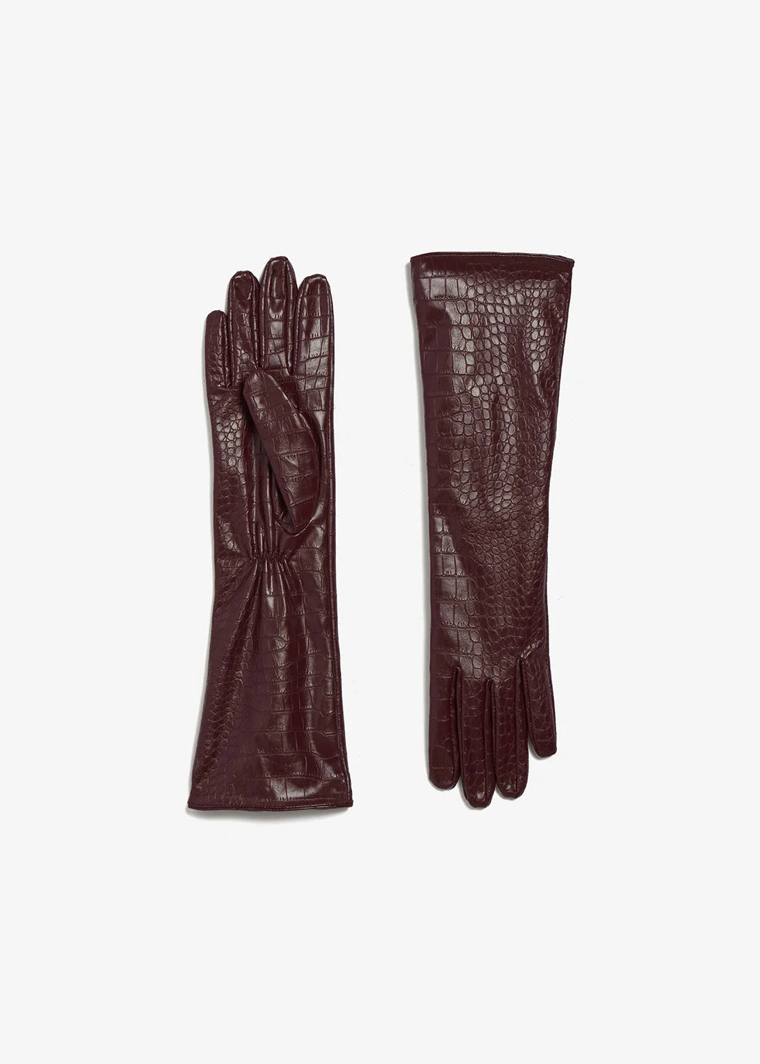 A pair of long burgundy leather gloves, one showing the back of the hand with a smooth finish and the other showing the front with an embossed crocodile pattern, on a light gray background.