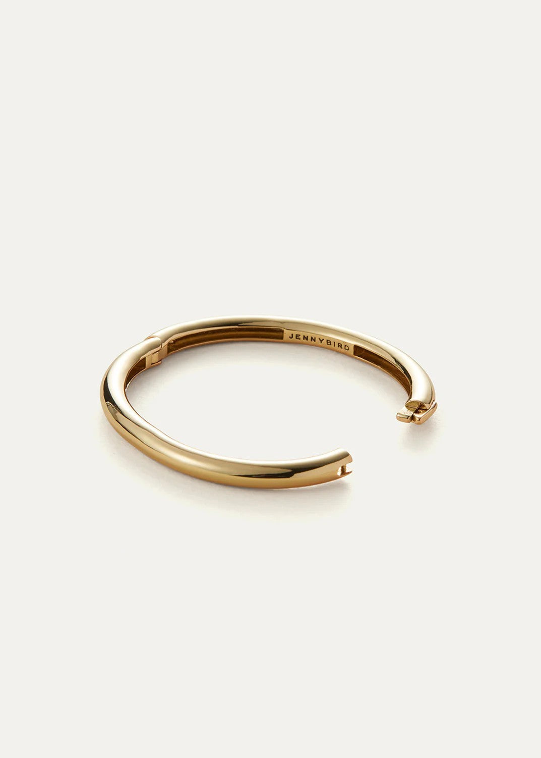 Gold bracelet on a white background