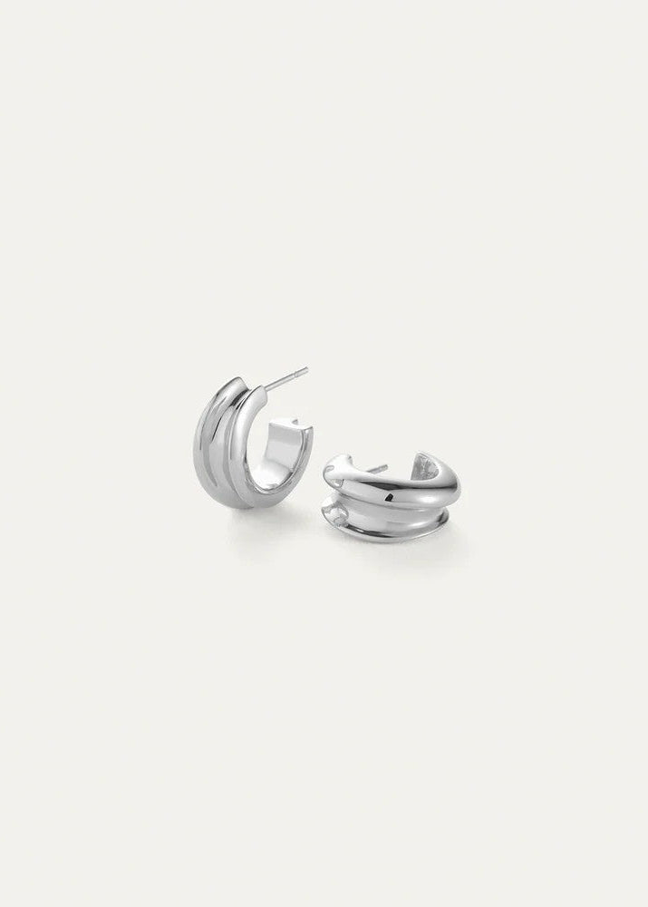 Pair of silver hoop earrings on a white background