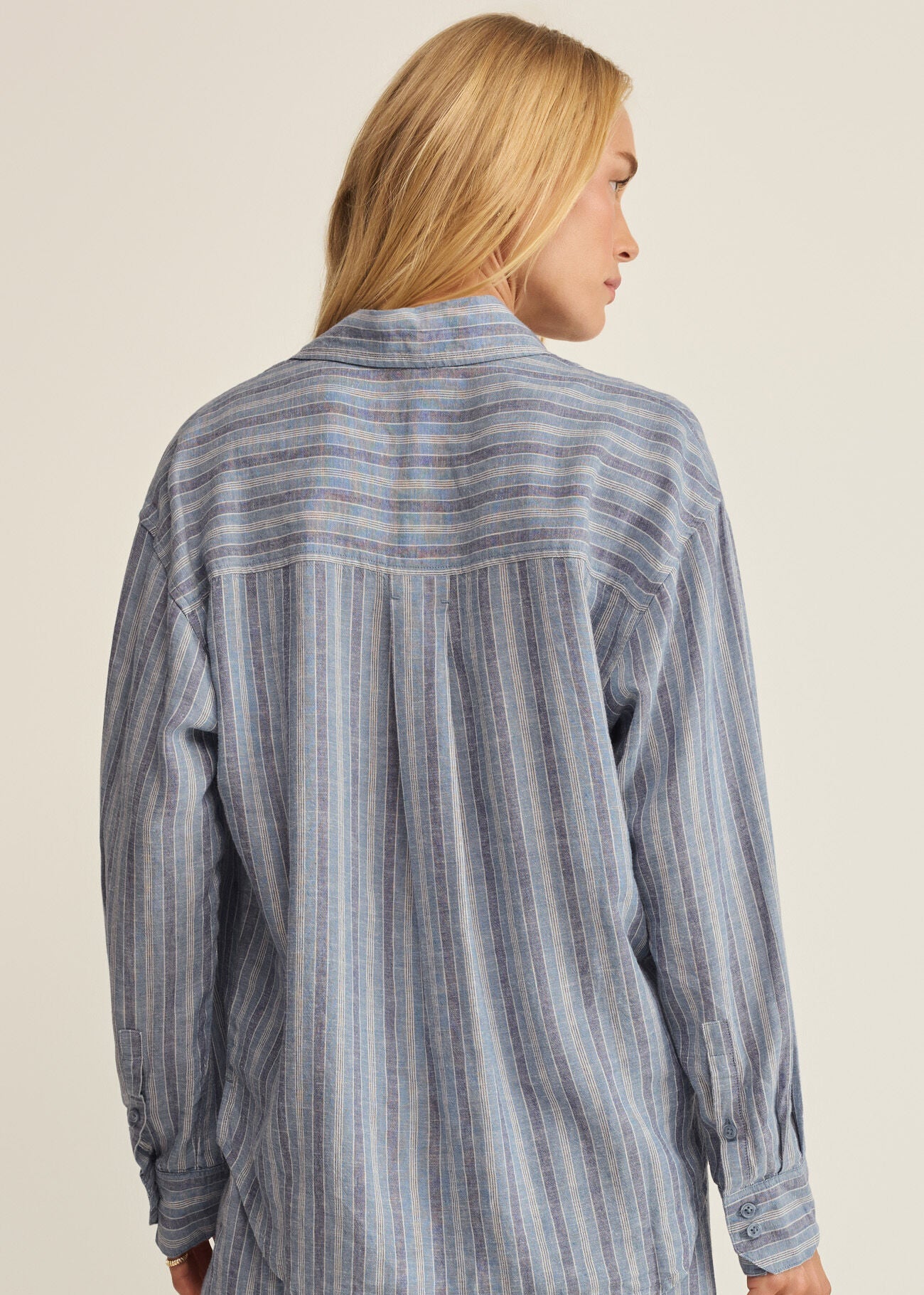 Woman in striped button up shirt