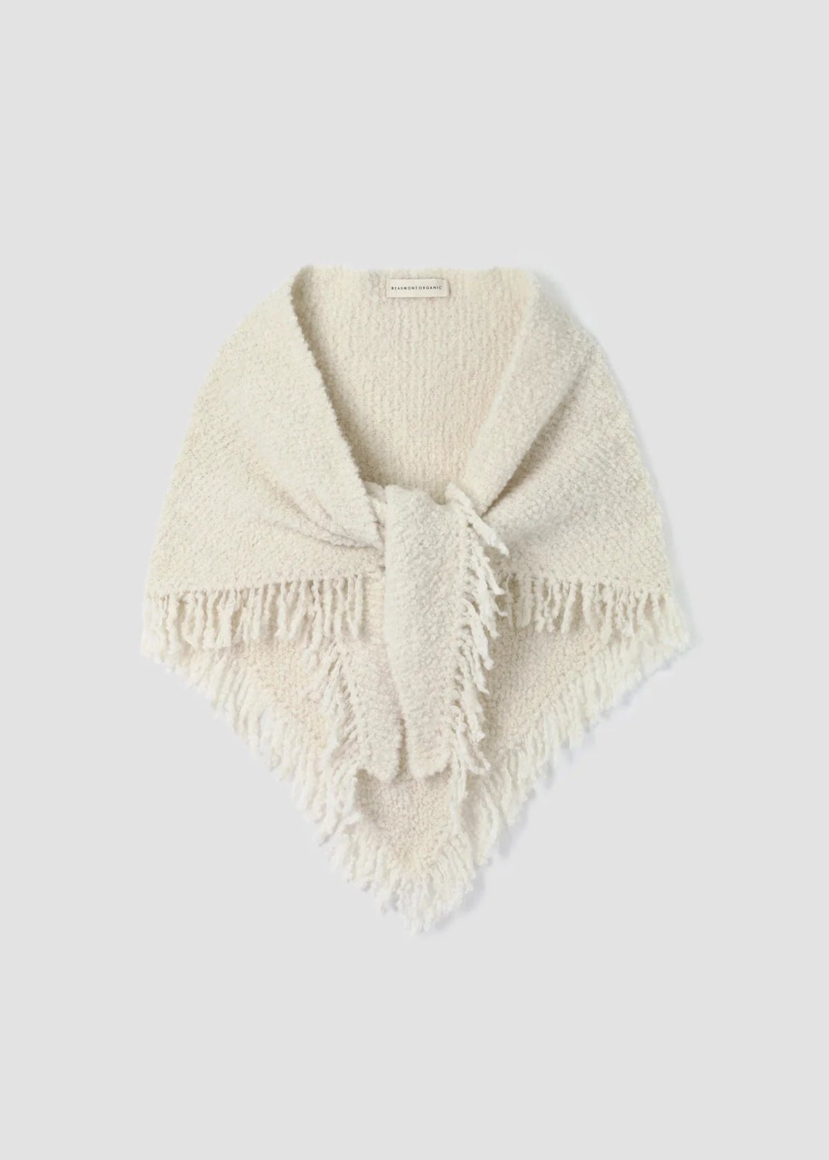 An off-white knit shawl scarf with fringed edges, tied in a knot at the center, displayed on a light gray background.