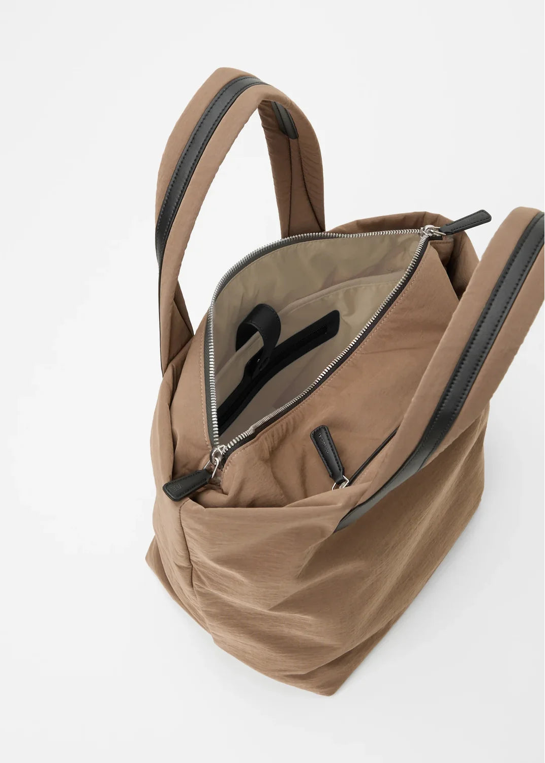 Brown backpack with zippers on a white background