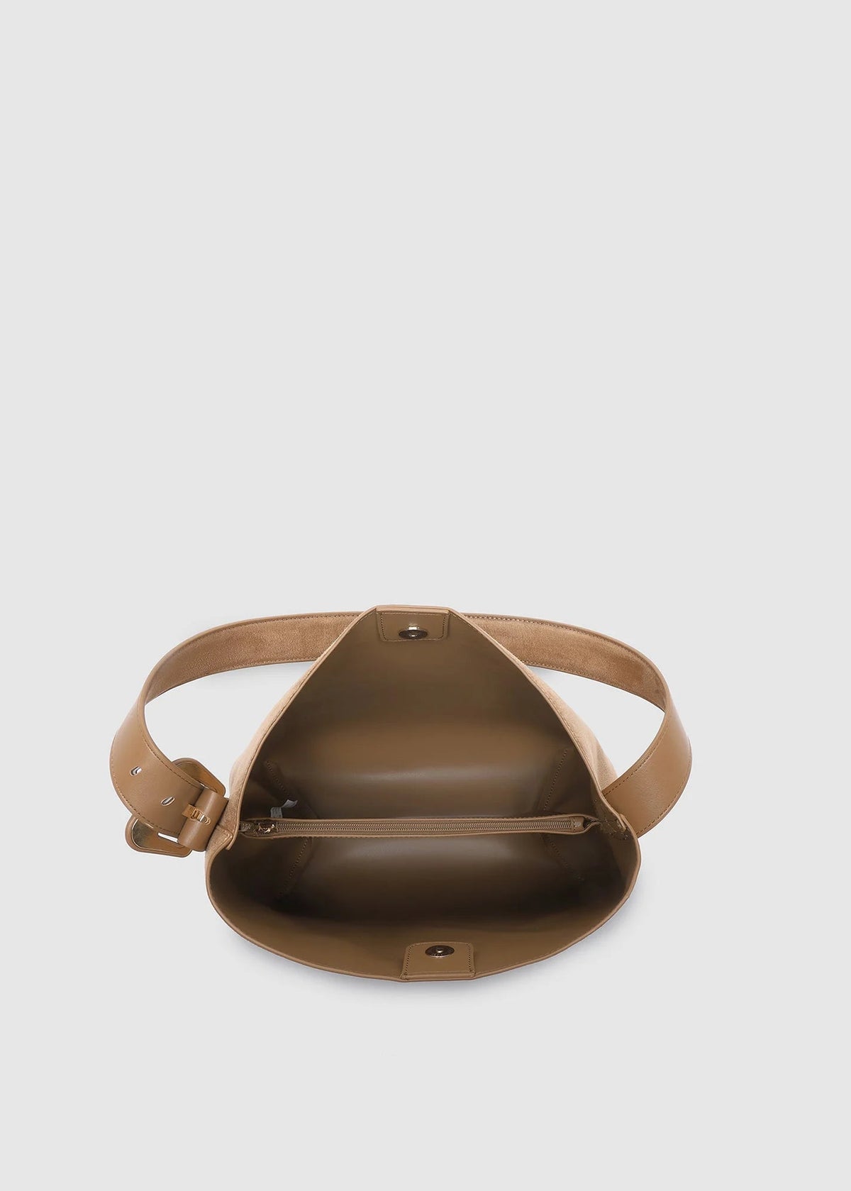 Brown leather bag on a light gray background