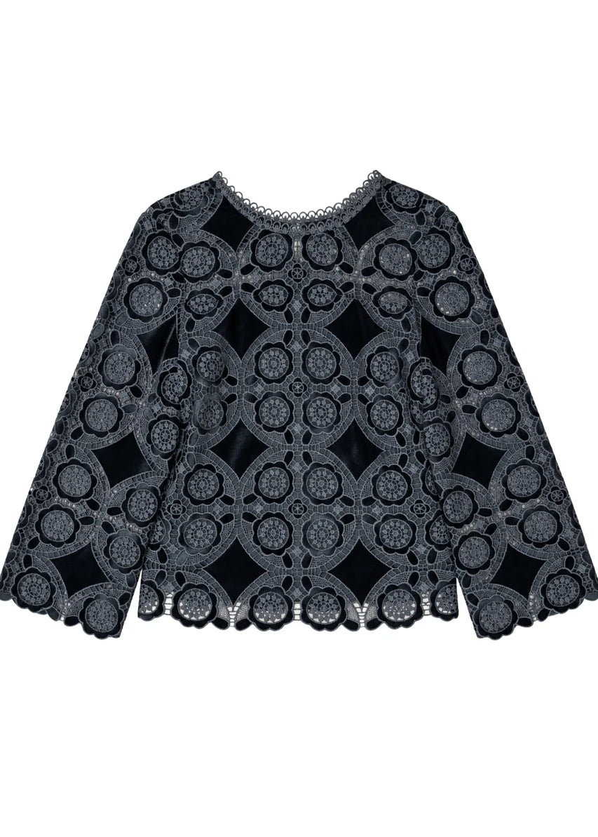 A black lace top with a geometric circular pattern and scalloped edges, displayed flat against a white background.