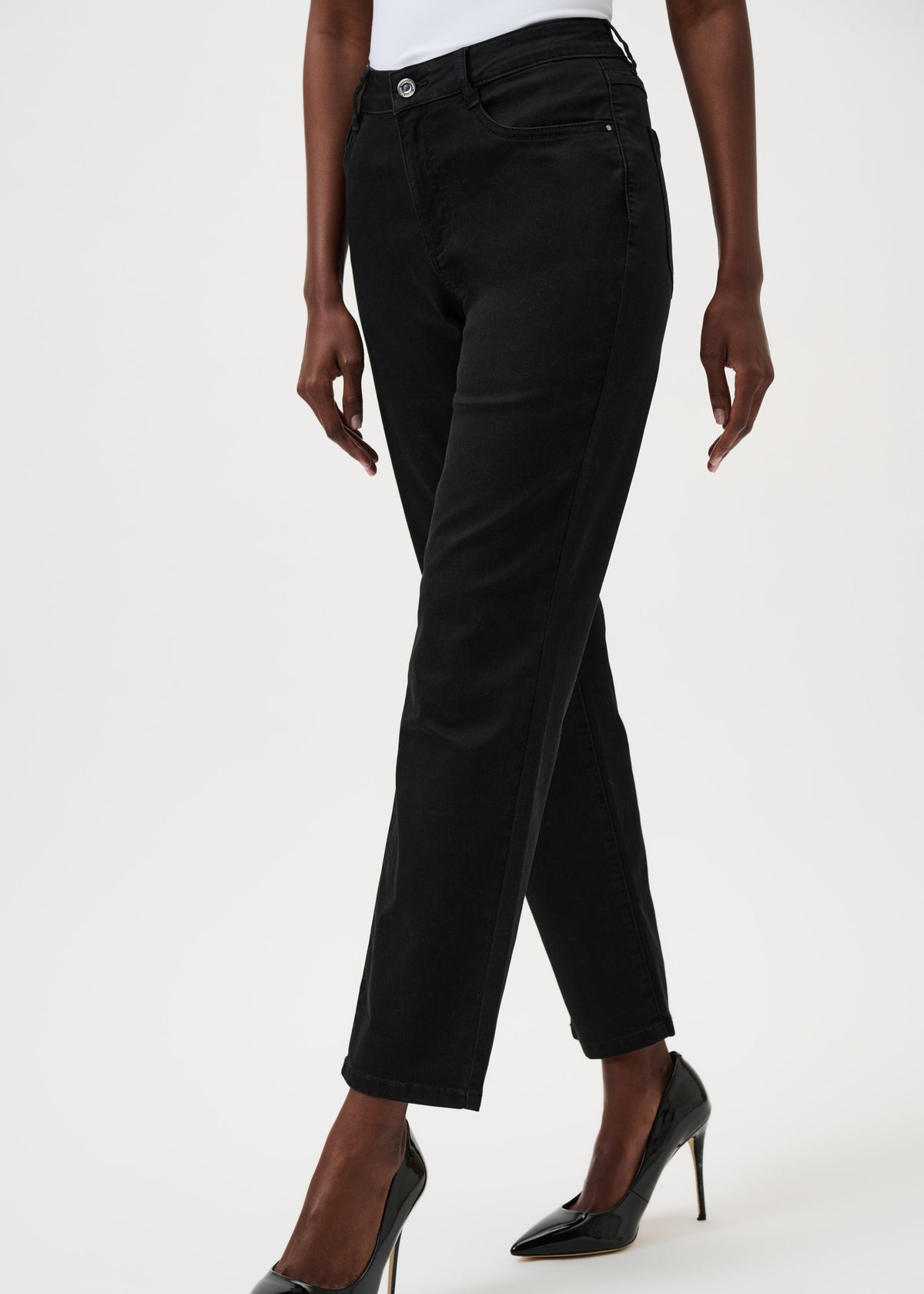 Black pants worn by a person on a white background