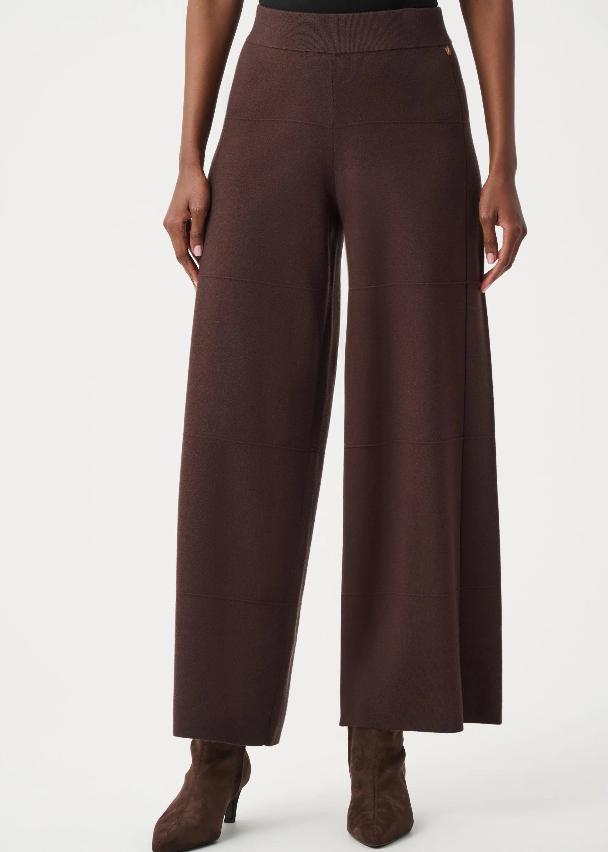 Brown wide-leg pants worn by a person on a white background