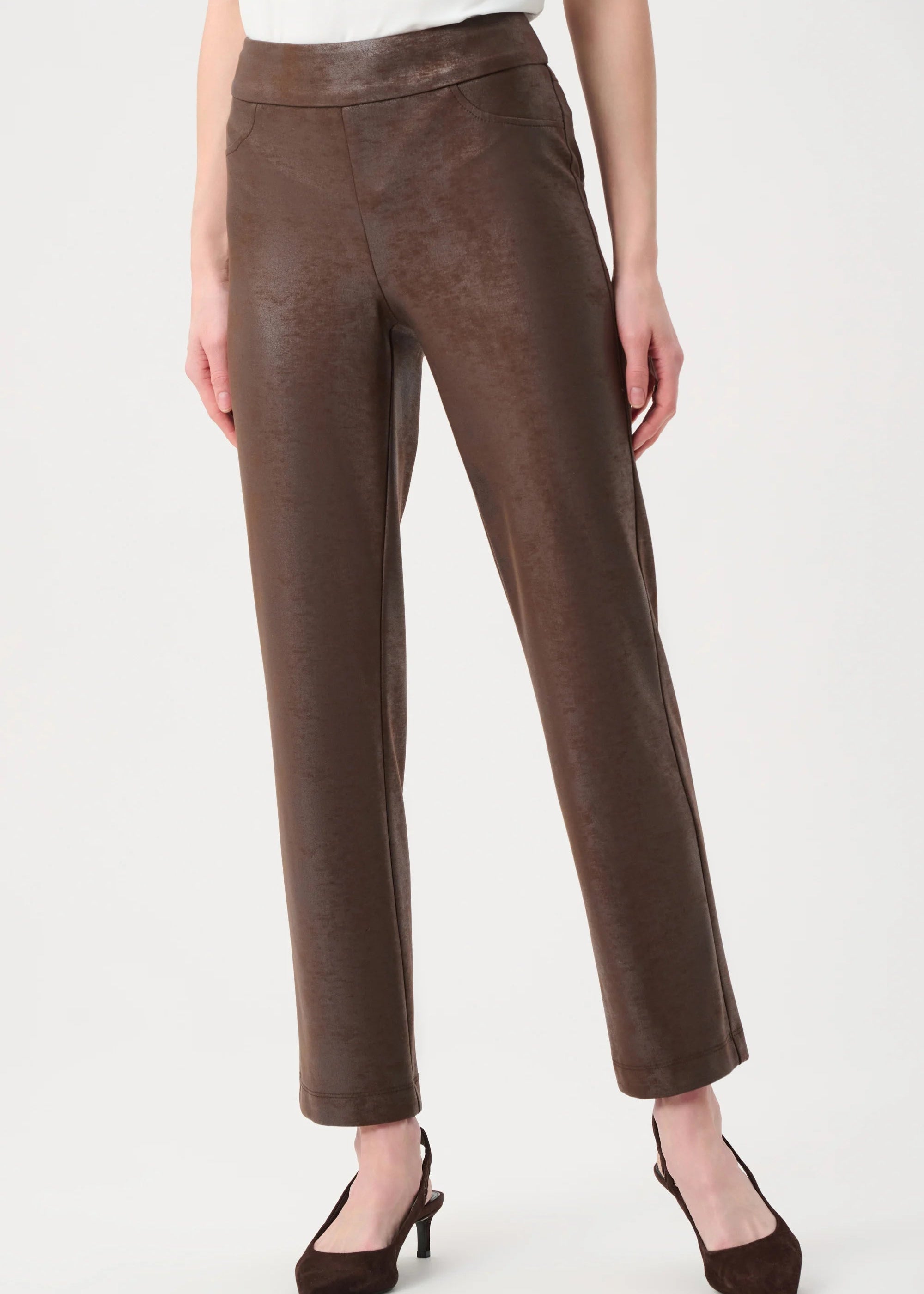 Brown pants worn by a person on a white background