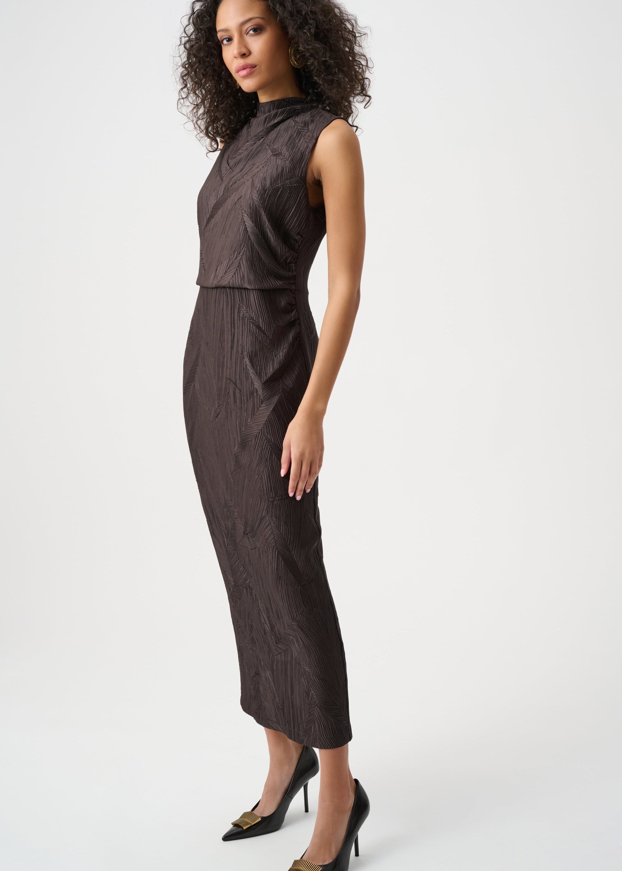 Woman wearing a brown dress on a white background