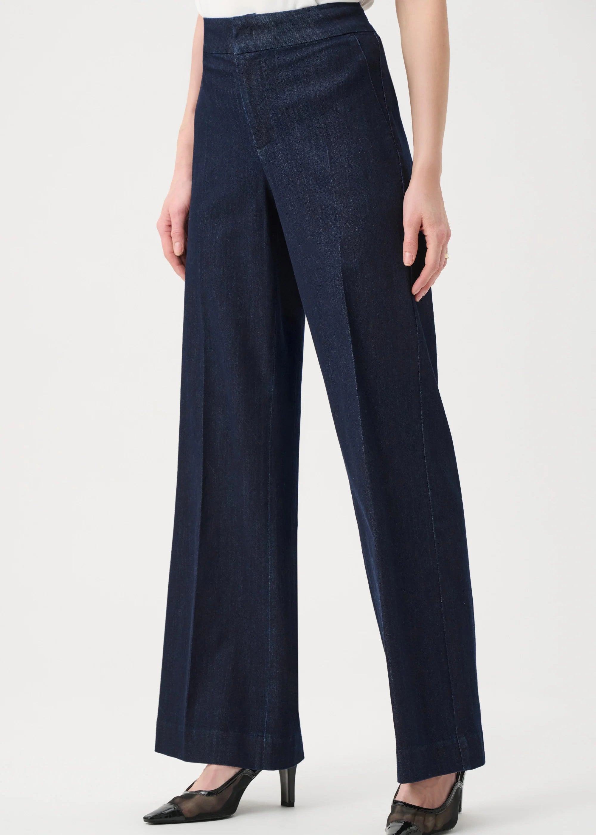 Navy blue wide-leg pants worn by a person on a white background