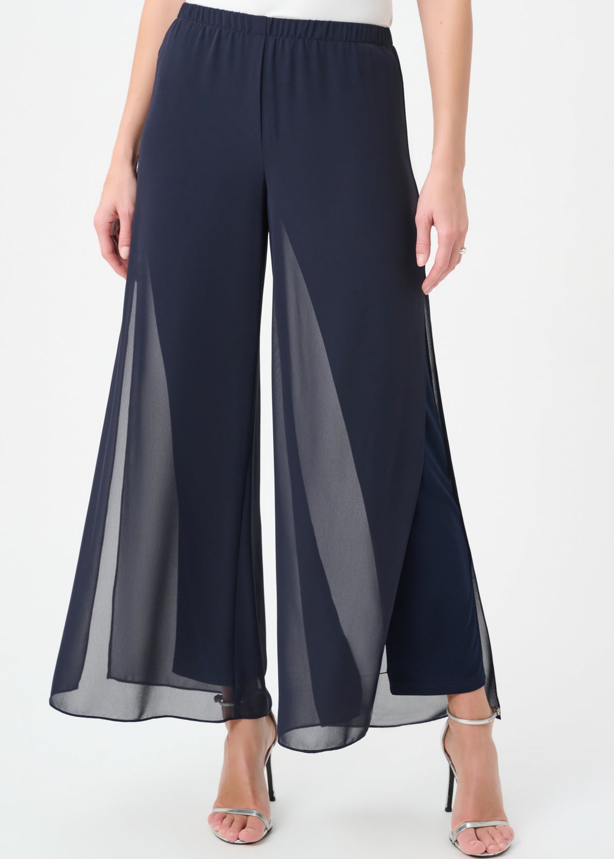 Navy blue wide-leg pants worn by a person on a white background