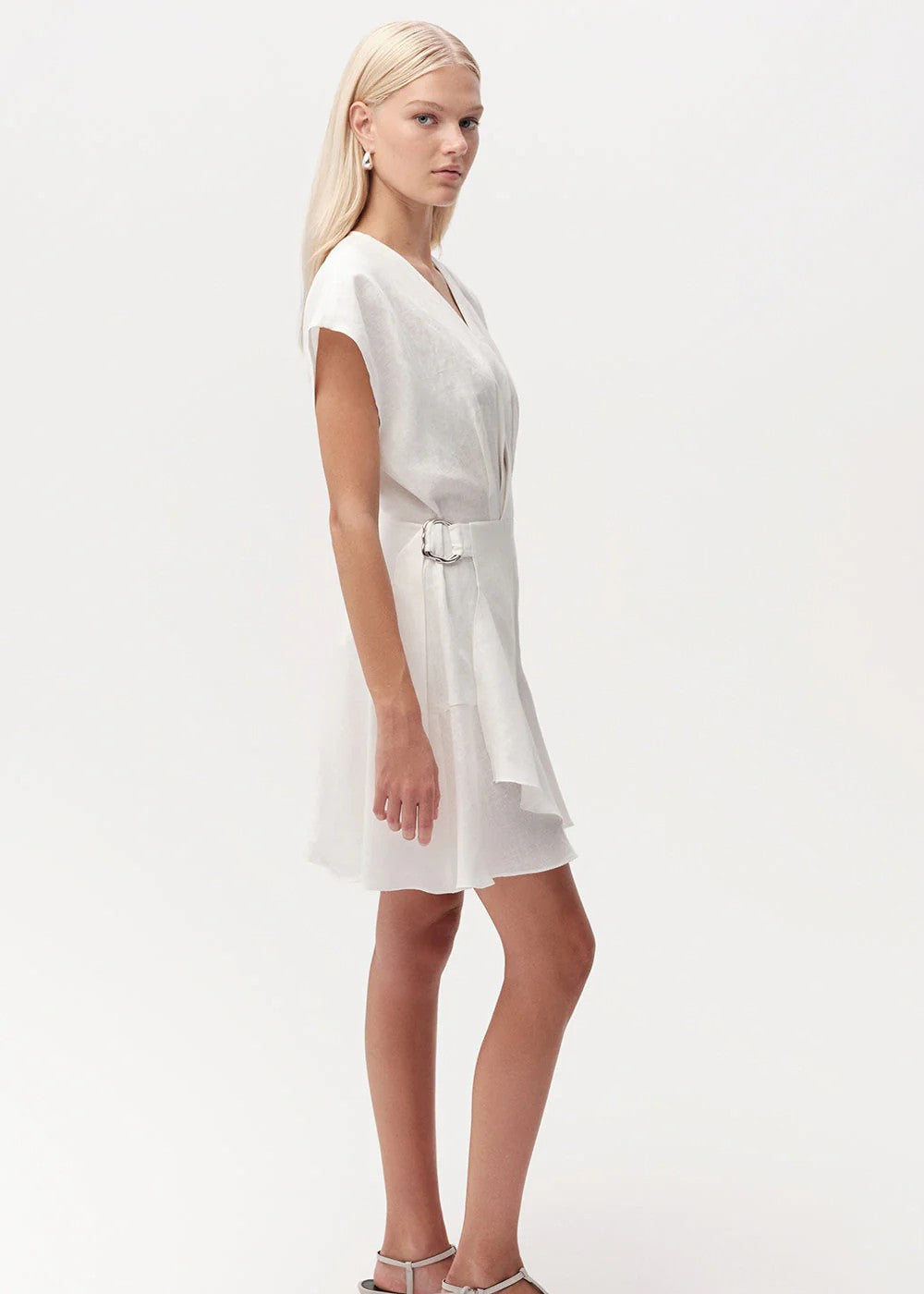 Woman wearing a white dress on a white background