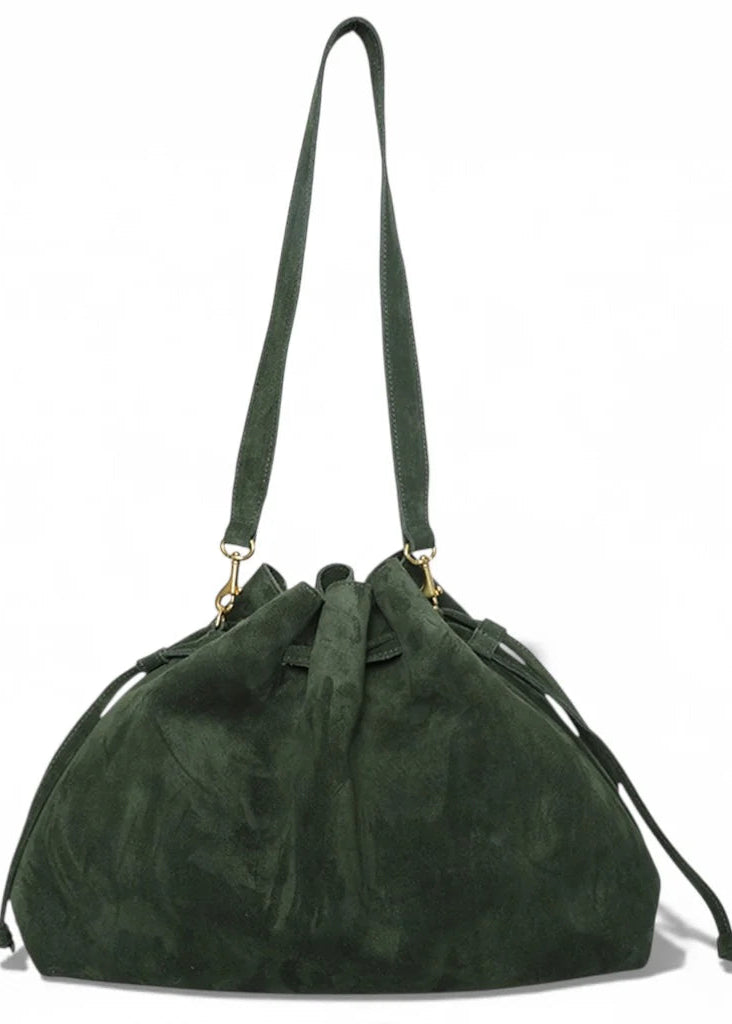 Green suede handbag with a strap on a white background