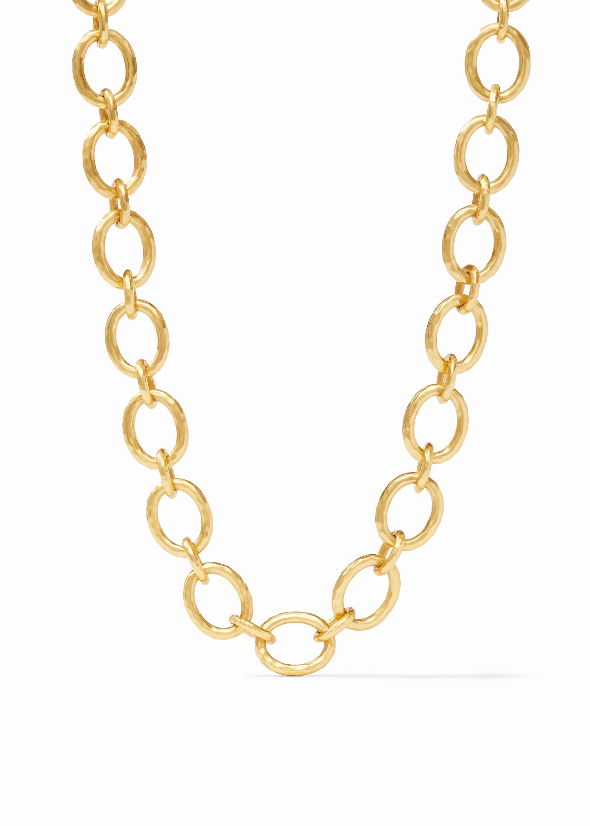 Gold chain necklace on a white background