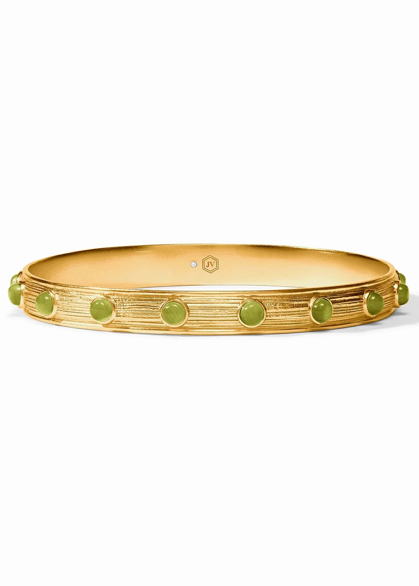 Gold bangle with green stones on a white background