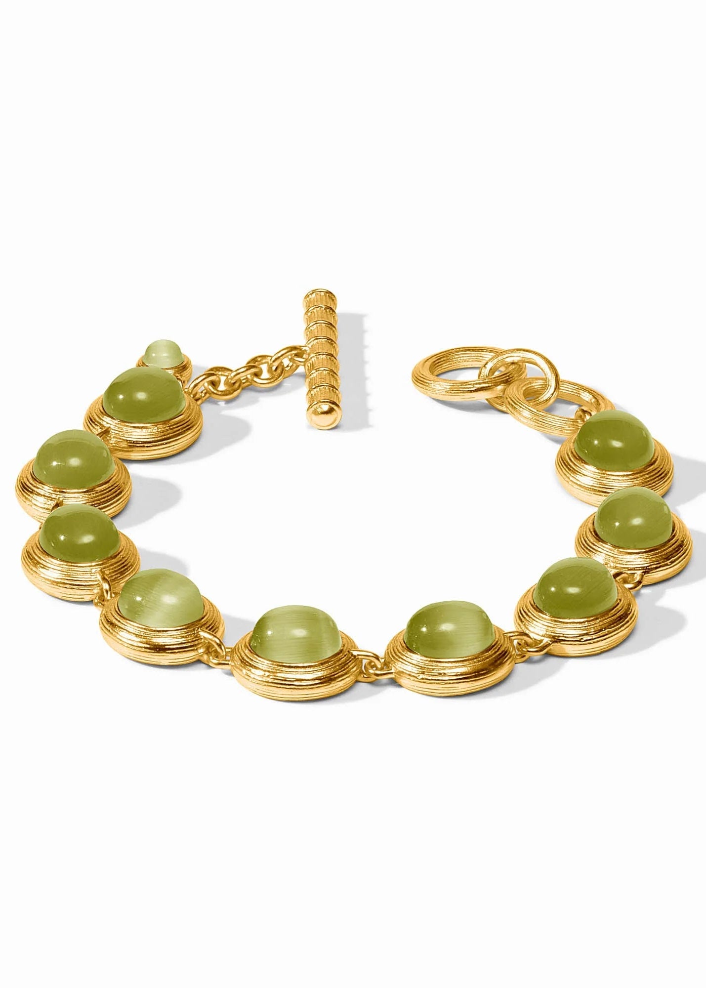 Gold bracelet with green beads on a white background