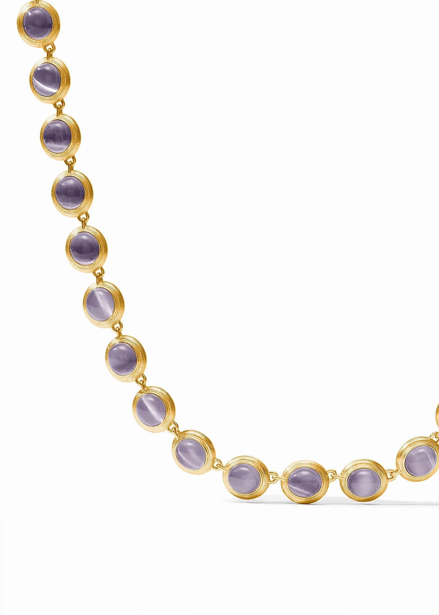 A gold chain necklace featuring oval purple cat's eye gemstones, displayed on a clean white background.