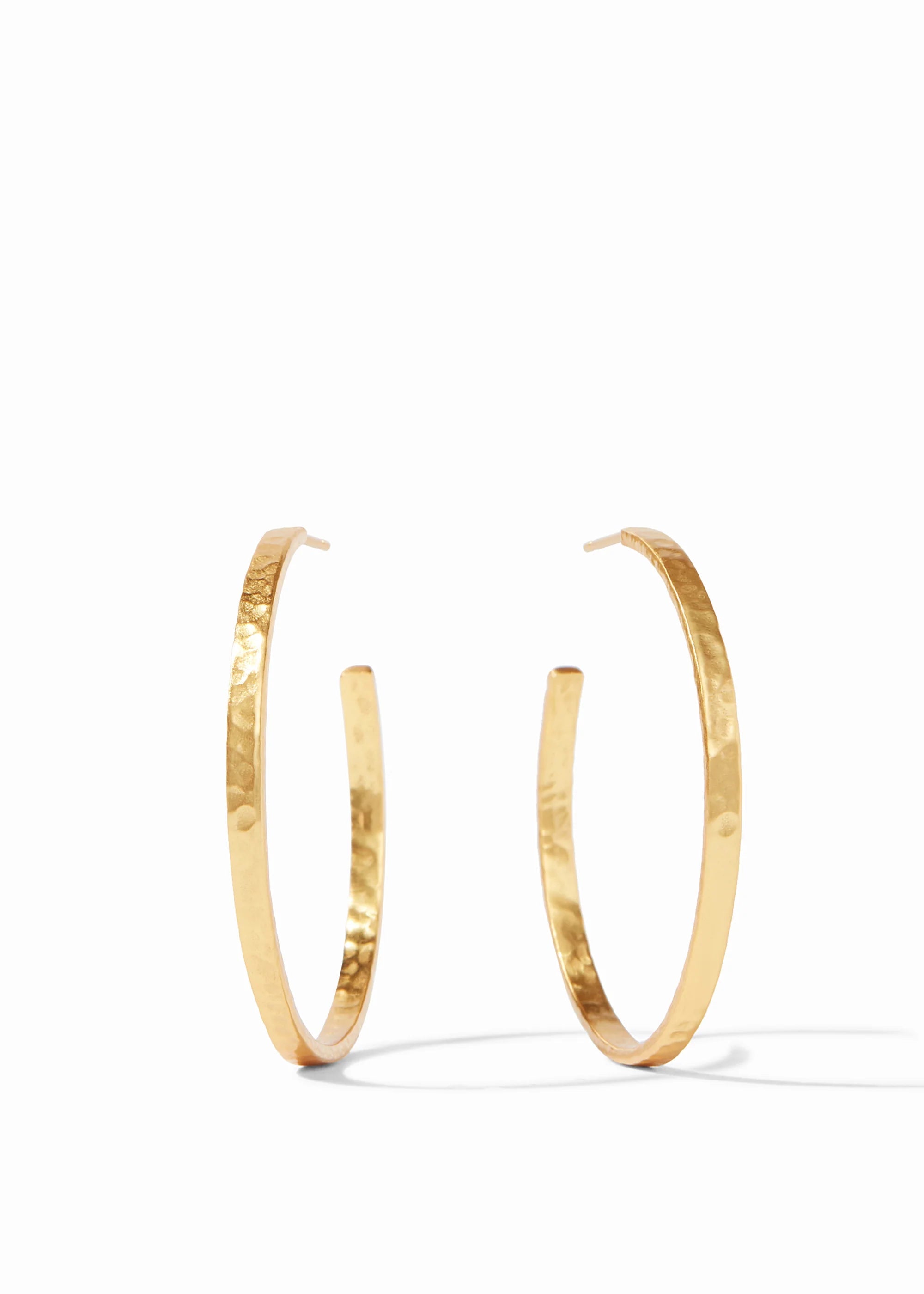Gold hoop earrings on a white background