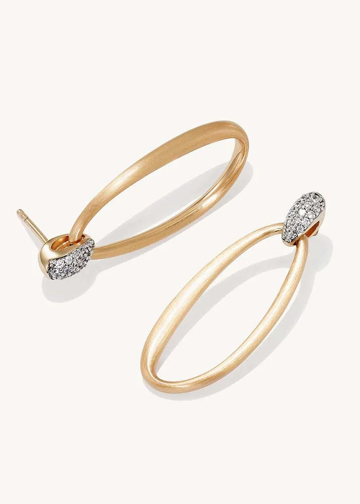 A pair of gold hoop earrings with small pavé-set clear stones at the ends, shown on a clean off-white background.