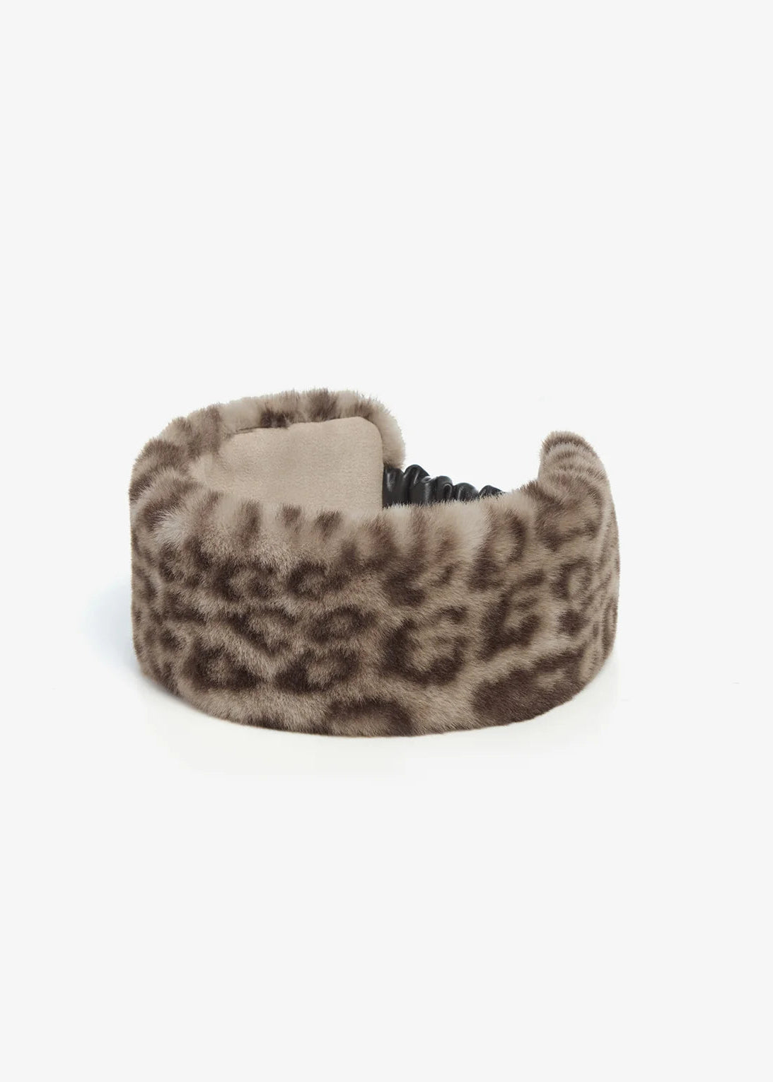 A wide, fuzzy cuff-style headband with a brown and beige leopard print pattern, shown on a plain light gray background.