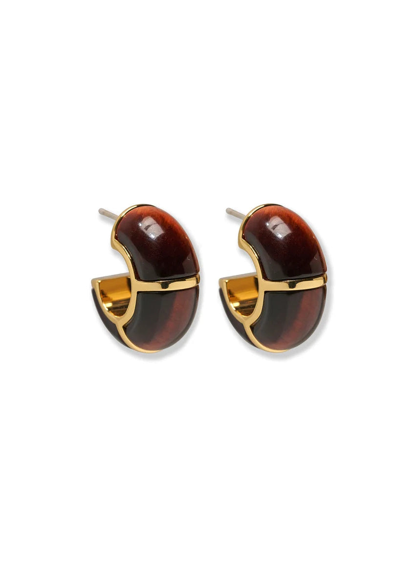 A pair of gold-tone hoop earrings with glossy dark brown and amber tortoiseshell inlay, shown on a plain white background.