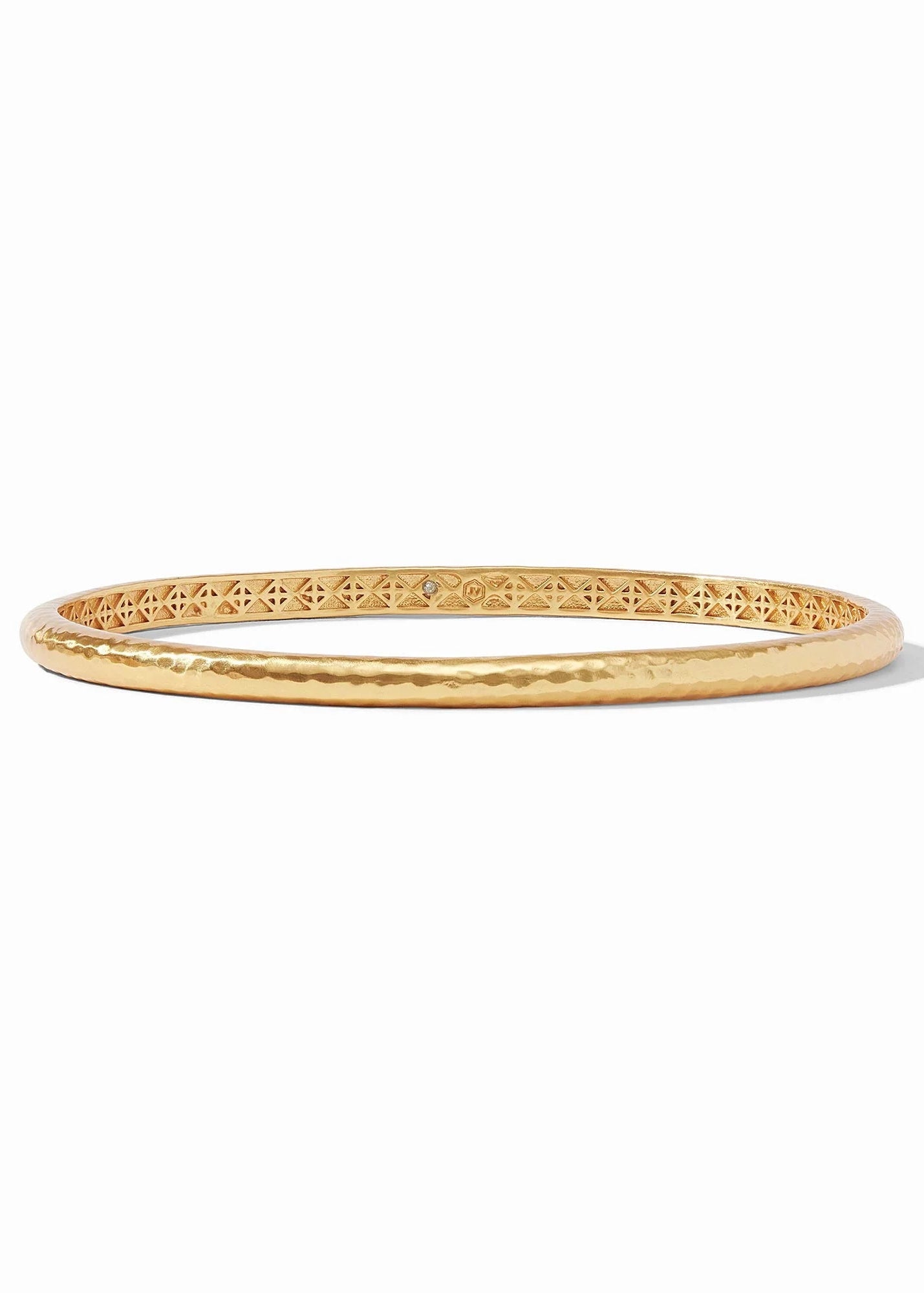 A gold-plated bangle bracelet with a textured hammered finish on the outer band and an intricate openwork filigree pattern on the inner band, shown on a plain white background.