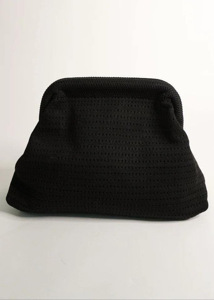 Black textured clutch bag on a white background