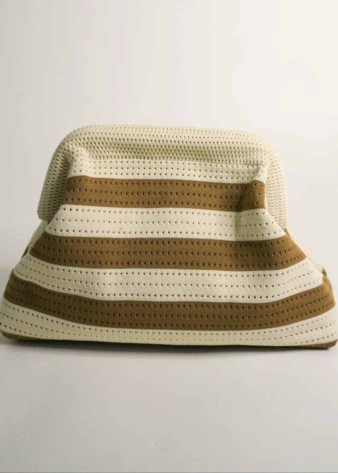 Striped bucket hat with brown and beige colors on a light gray background