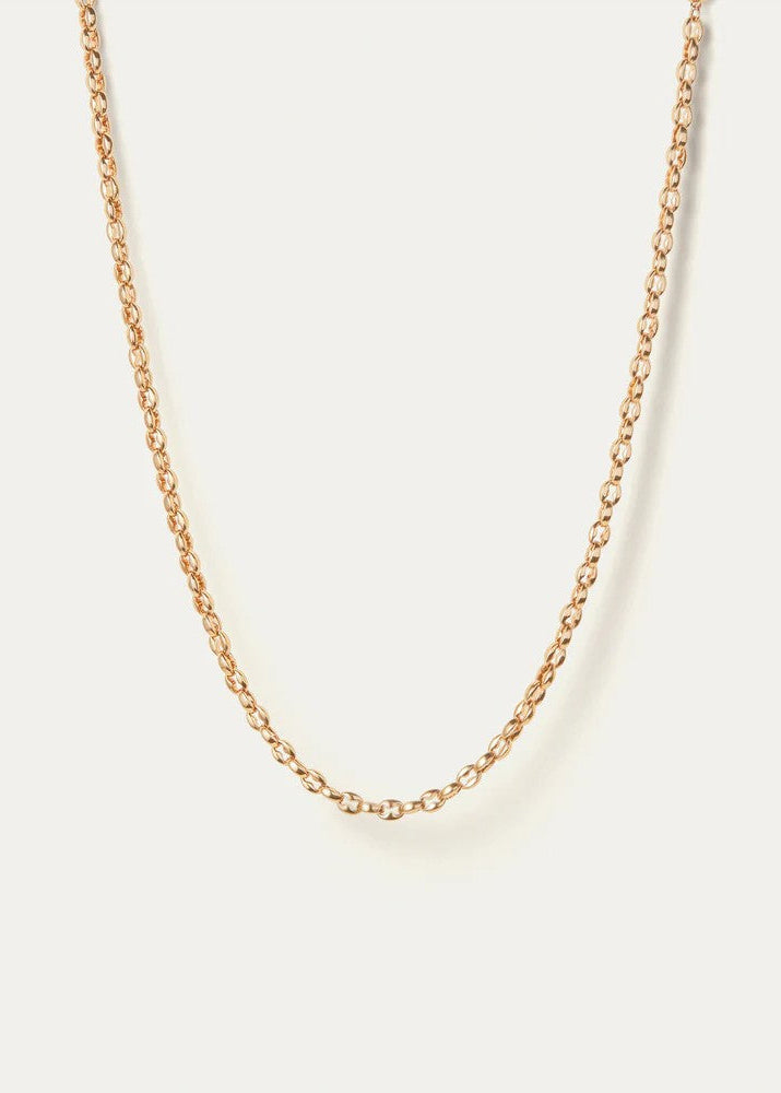 A delicate gold chain necklace with a textured, rope-like link design, displayed in a U-shape against a solid off-white background.