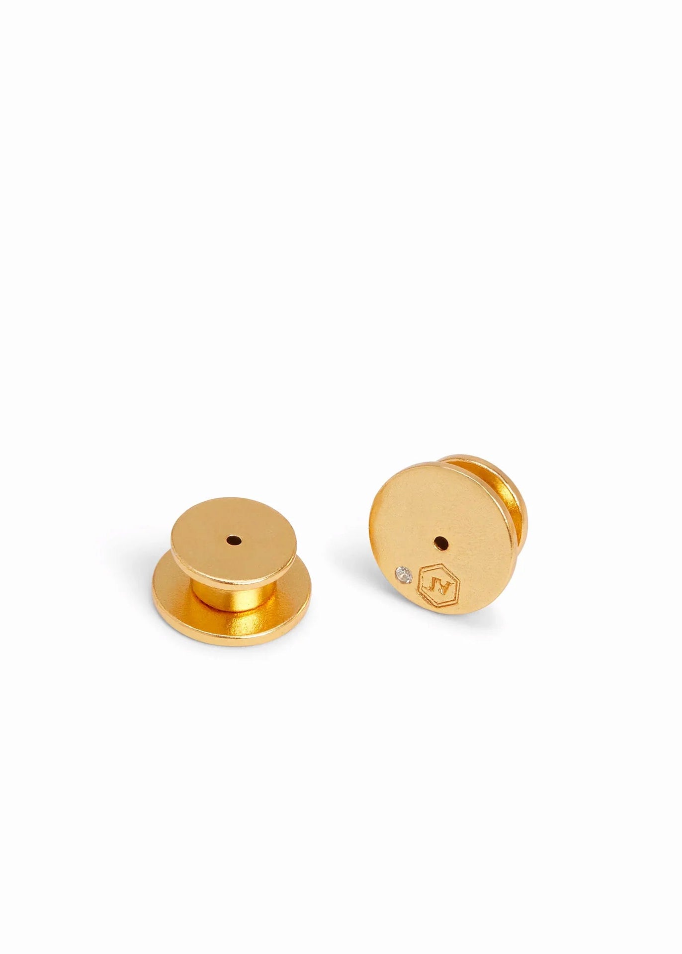 Gold earrings on a white background