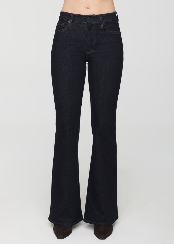 Dark blue flared jeans on a white background