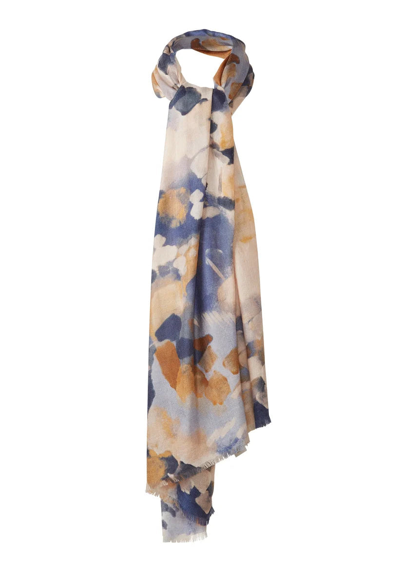 A lightweight scarf with an abstract watercolor pattern in shades of blue, beige, and brown, styled in a knot on a plain white background.