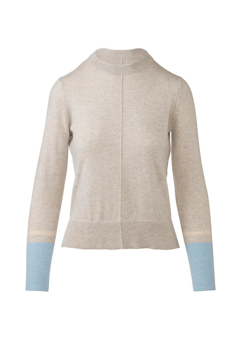 A light beige knit mock neck cardigan sweater with light blue ribbed cuffs, shown on a plain white background.