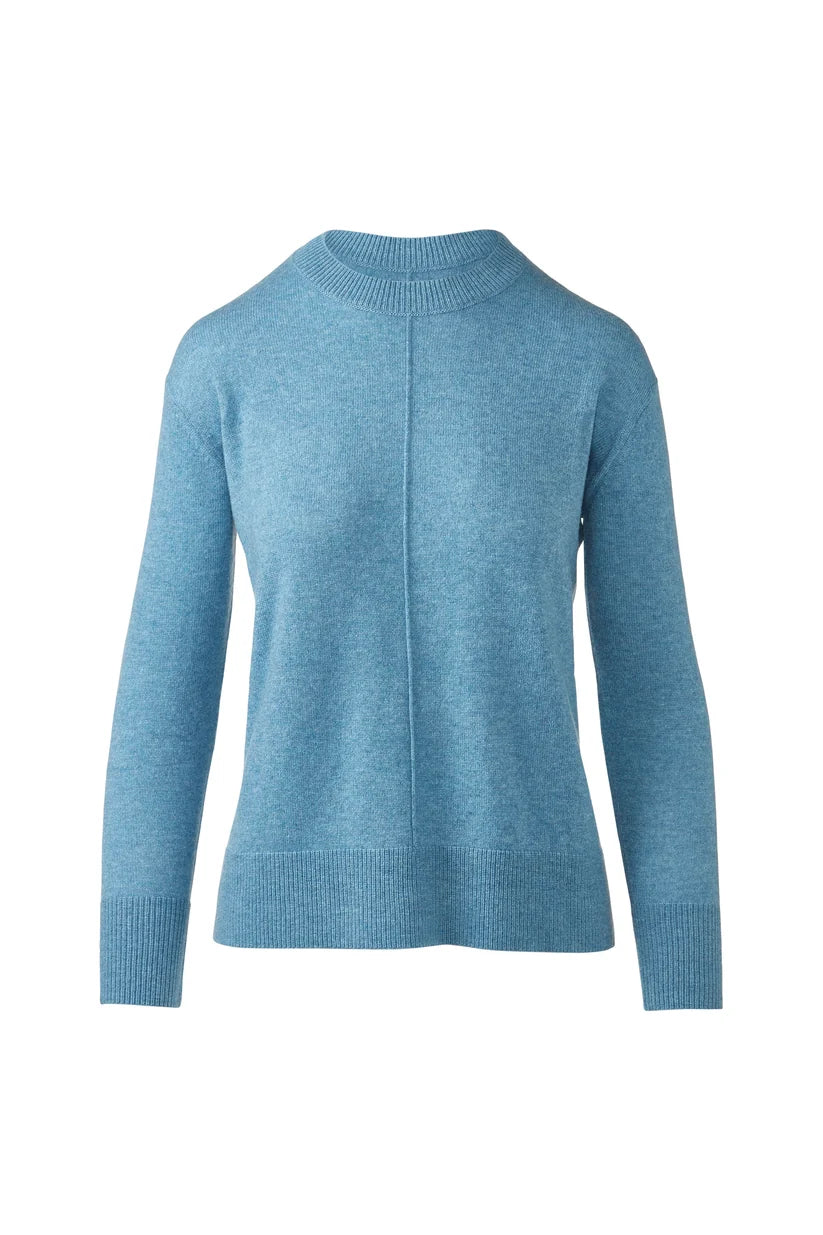 A light blue knit sweater with a mock neck and long sleeves, shown against a plain white background.