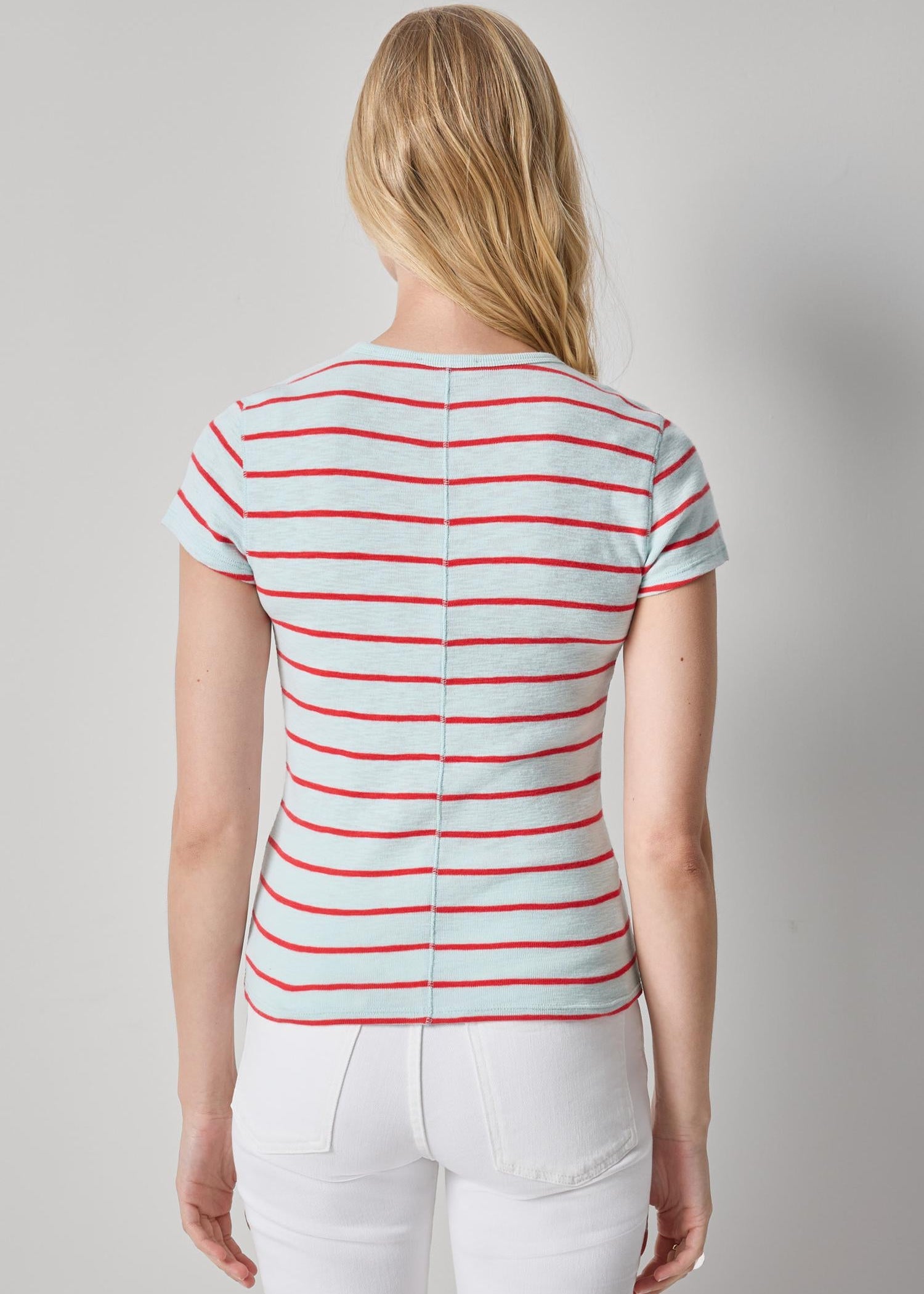 woman wearing stripped shirt on grey backgound