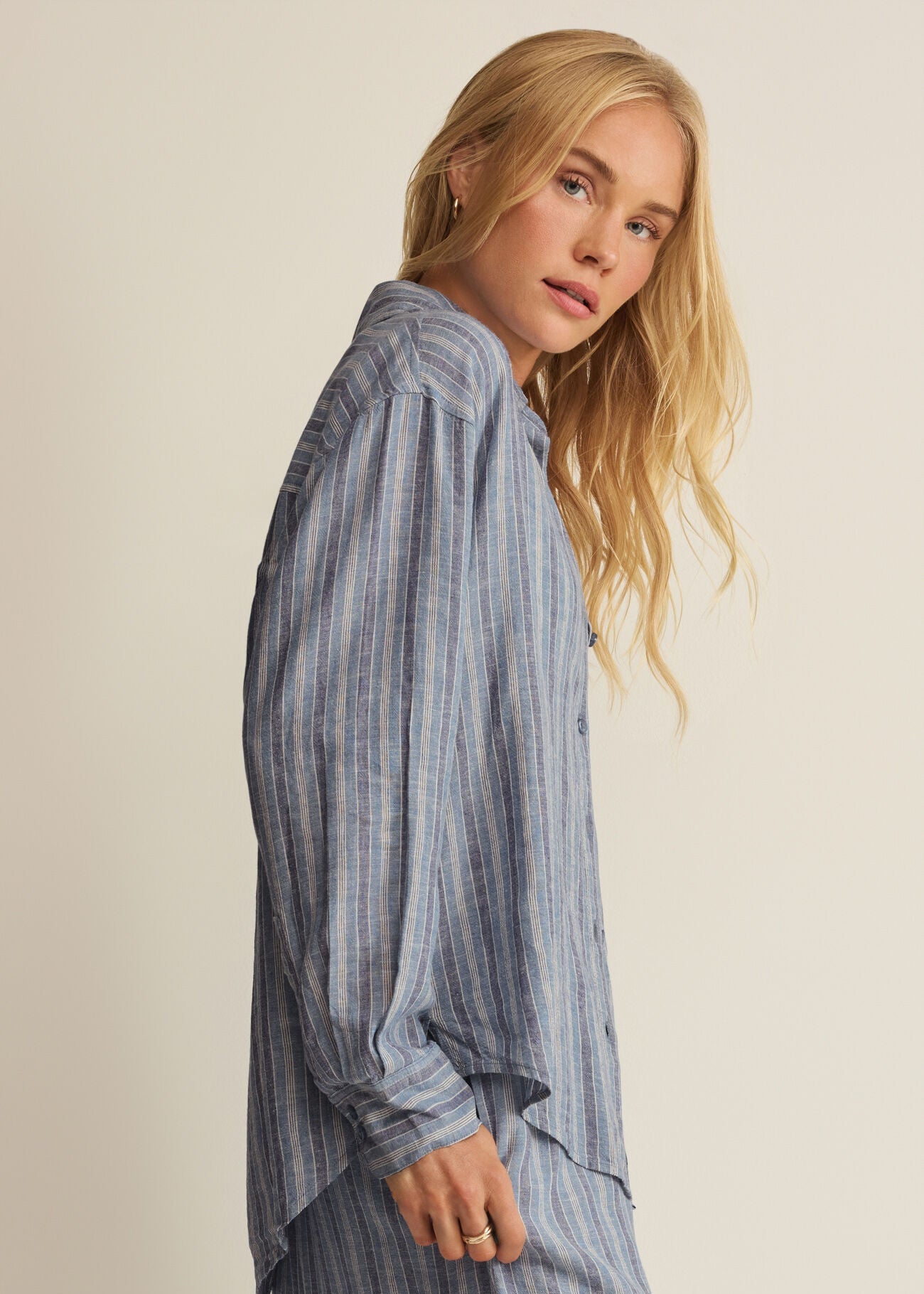 Woman in striped button up shirt