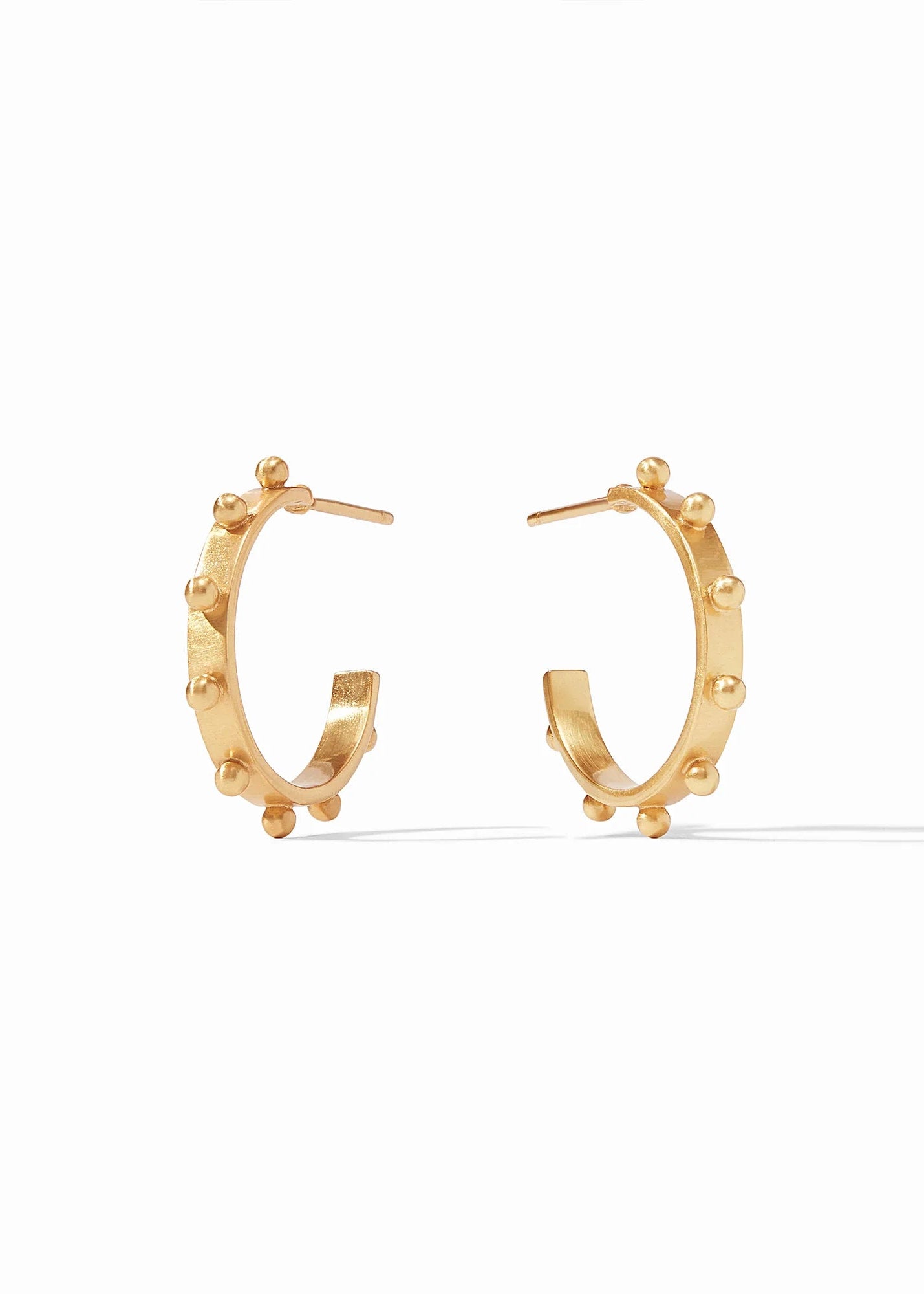 Gold hoop earrings on a white background