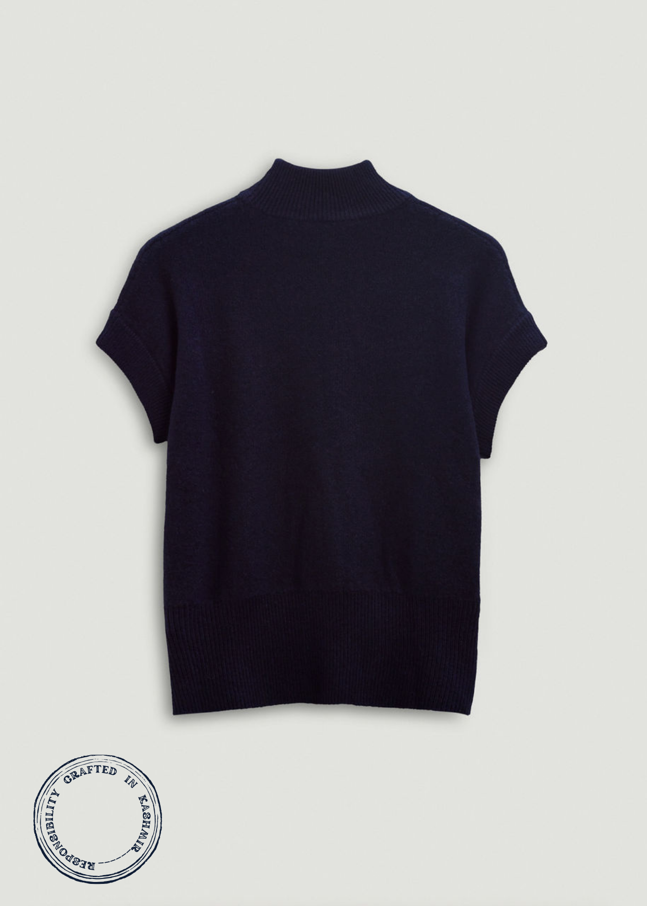 Navy blue turtleneck sweater on a light gray background