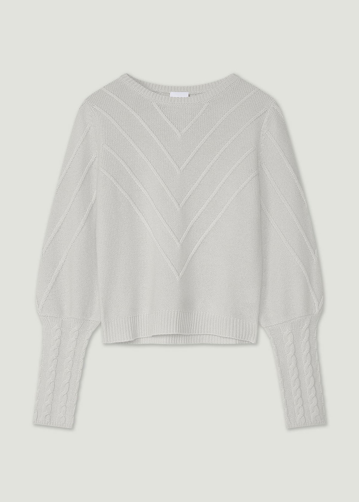 Light gray sweater with a textured pattern on a light gray background