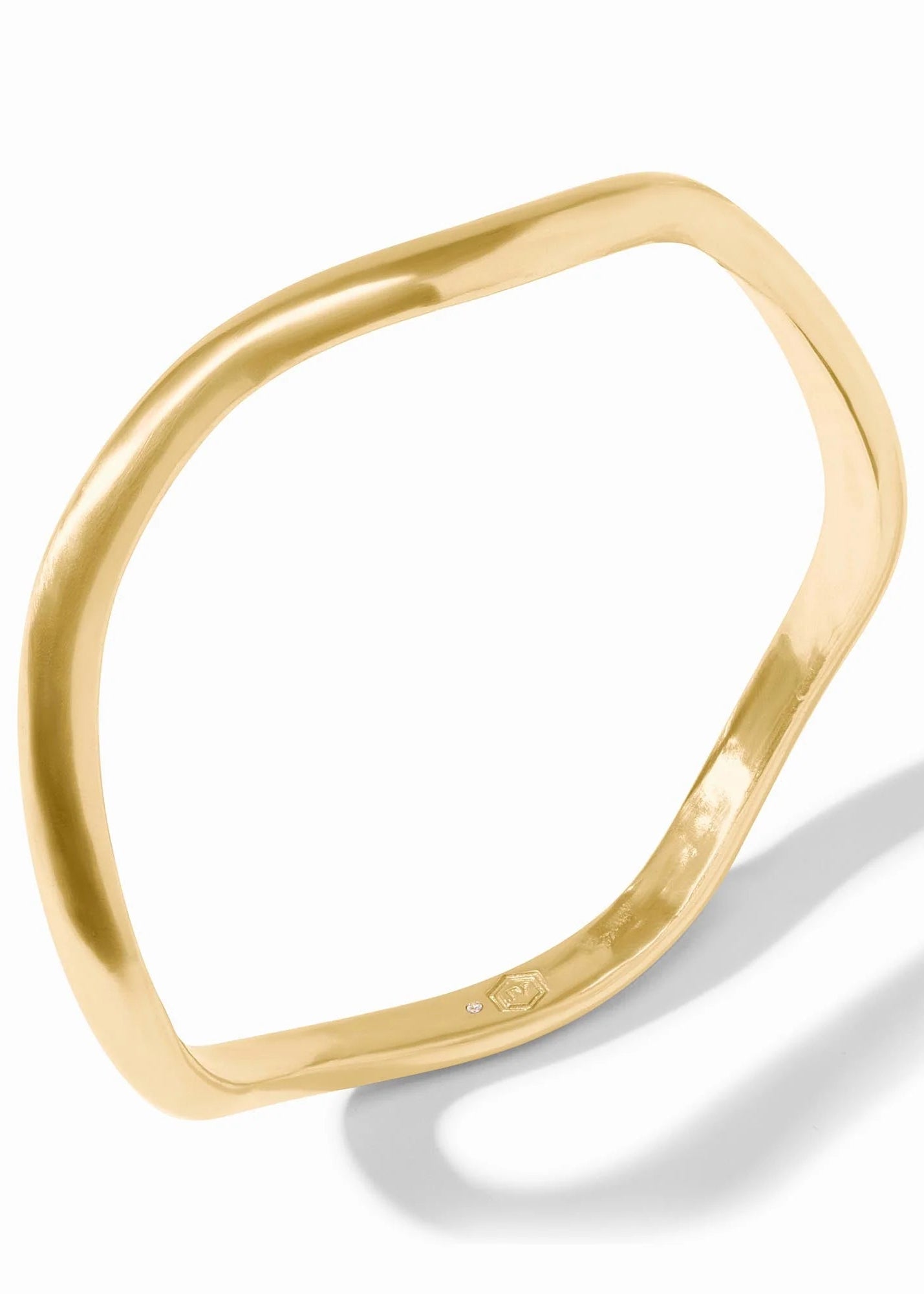 Gold ring with a modern design on a white background