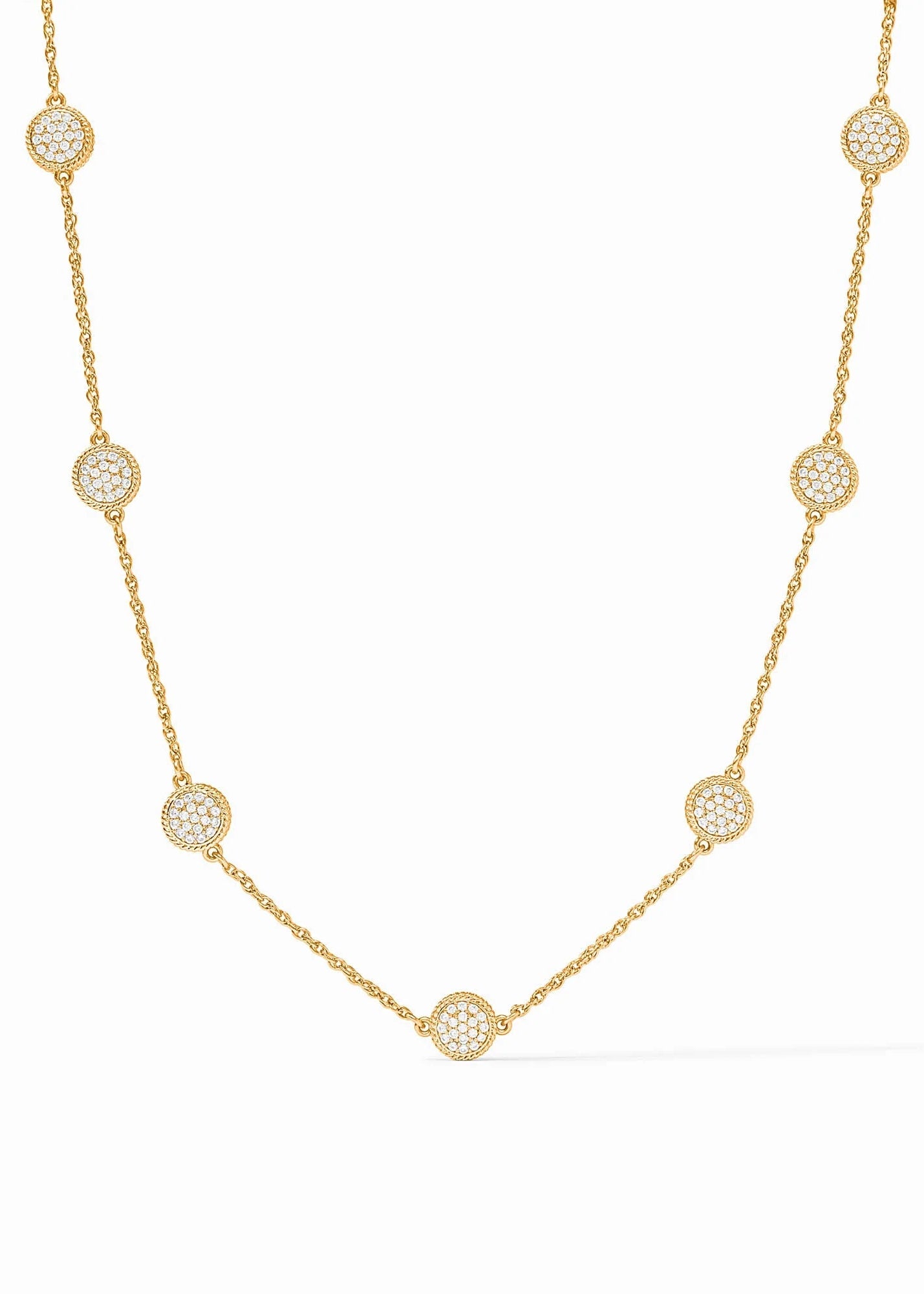 Gold necklace with circular diamond pendants on a white background